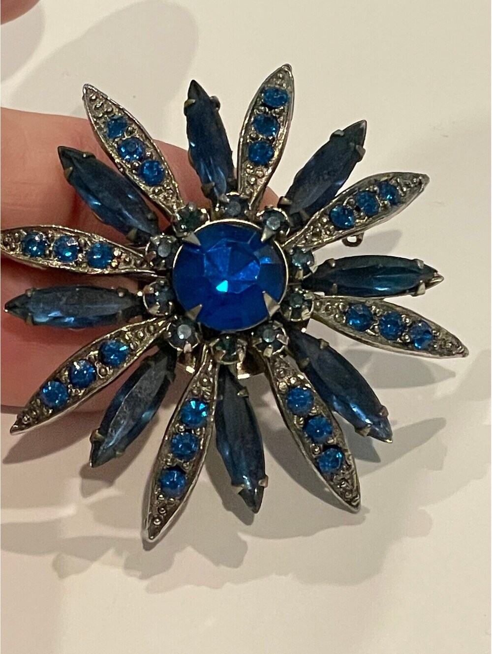 Vintage blue costume starburst pin